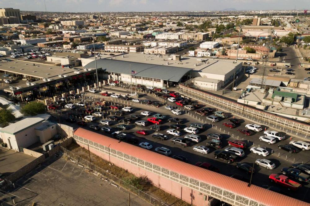 PATRICK T. FALLON - AFP via GETTY IMAGES
An aerial picture taken on June 24, 2021 shows cars waiting to cross into the United States from Mexico on the Paso del Norte International Bridge over the Rio Grande at the US-Mexico border between El Paso and the Mexican city of Ciudad Juarez, Chihuahua state, Mexico, in El Paso, Texas.