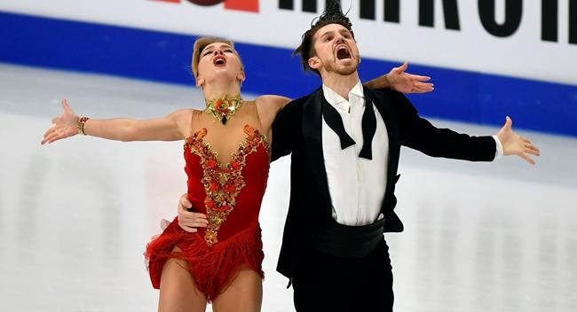 Russian ice dancers Alexandra Stepanova and Ivan Bukin perform during the Ice Dance - Rhythm Dance at the Figure Skating World Championships in Stockholm, Sweden, Friday, March 26, 2021. (AP Photo/Martin Meissner)