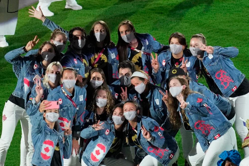 Lee Jin-man - AP FILE PHOTO
Canadian athletes pose for a photo during the closing ceremony in the Olympic Stadium at the 2020 Summer Olympics.