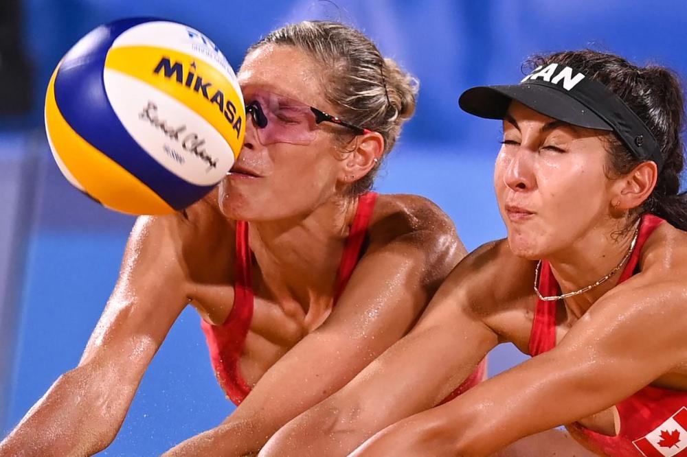 DANIEL LEAL-OLIVAS - AFP via GETTY IMAGES
Canadian duo and world champions Sarah Pavan, left, Melissa Humana-Paredes won their opening five matches of the Tokyo tournament without dropping a set before falling behind early and going the distance in a quarterfinal loss to Australia.