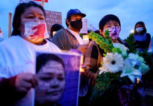 Carol Dube, husband of Joyce Echaquan and her mother Diane Echaquan Dube, right, attend a vigil in front of the hospital in Joliette, Que. on Tuesday, September 29, 2020. A nurse has been fired after an Indigenous woman who was dying Monday night in hospital was subjected to degrading remarks, Quebec's premier said Tuesday. THE CANADIAN PRESS/Paul Chiasson