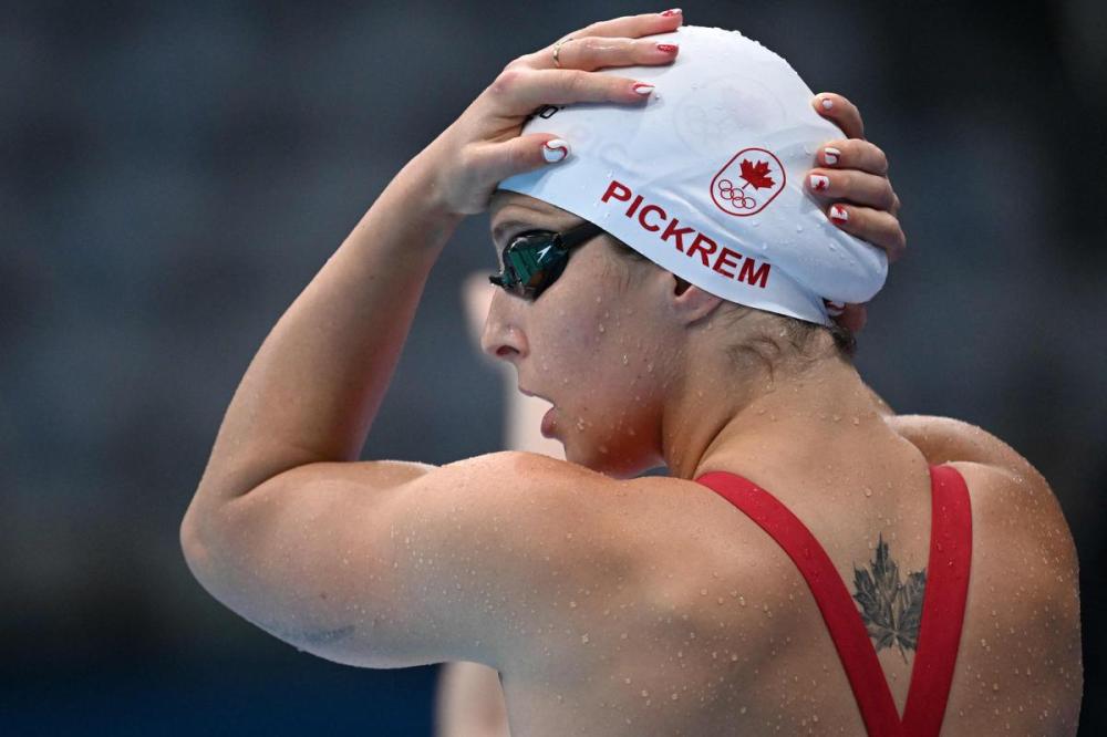 JONATHAN NACKSTRAND - AFP via GETTY IMAGES
Sydney Pickrem’s vivid description of she felt before racing the 4x100 medley relay cracked up her Canadian teammates.