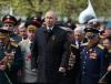 ANTON NOVODEREZHKIN - SPUTNIK/AFP via GETTY IMAGES
Russian President Vladimir Putin attends a flower-laying ceremony at the Tomb of the Unknown Soldier after the Victory Day military parade in Moscow on May 9, 2022.