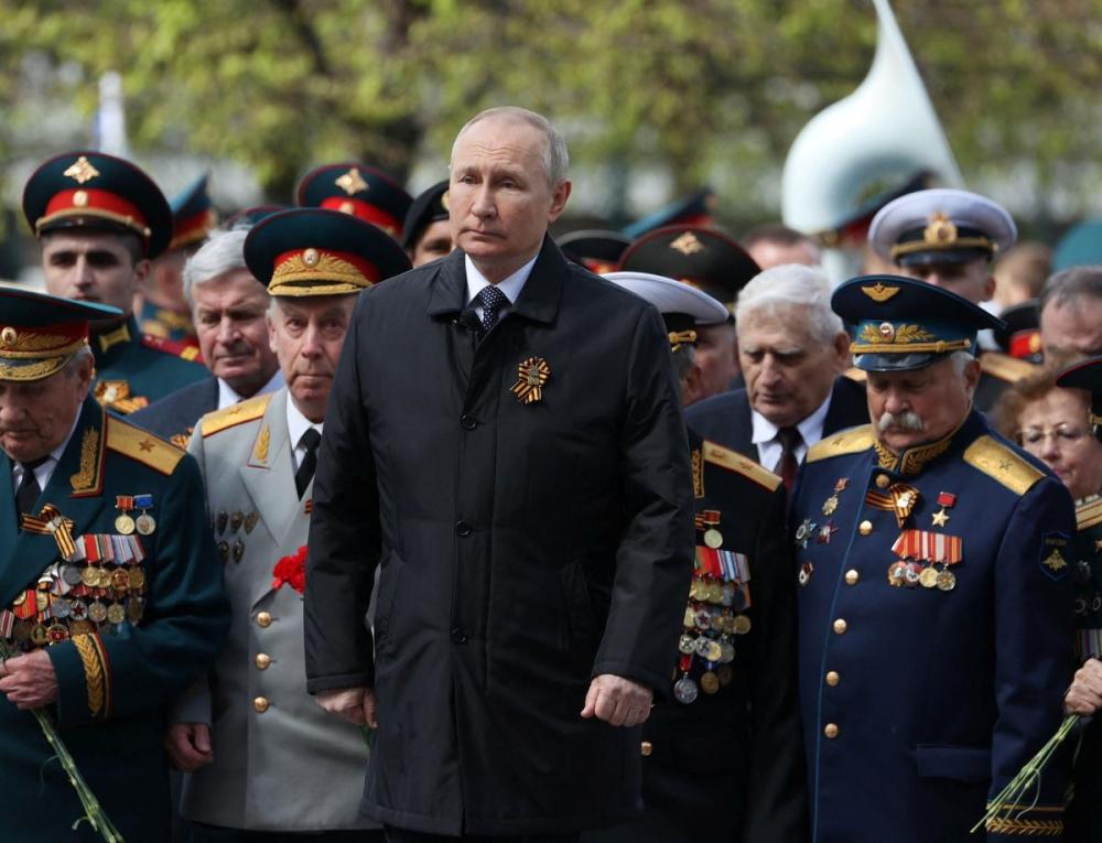ANTON NOVODEREZHKIN - SPUTNIK/AFP via GETTY IMAGES
Russian President Vladimir Putin attends a flower-laying ceremony at the Tomb of the Unknown Soldier after the Victory Day military parade in Moscow on May 9, 2022.