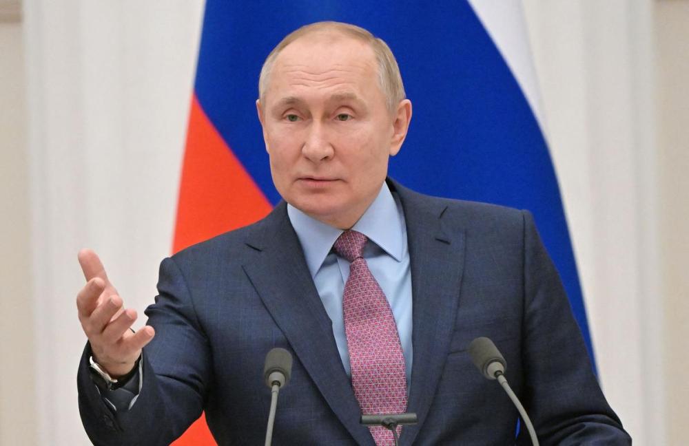 - Sputnik/AFP via GETTY IMAGES
Russia's President Vladimir Putin gestures as he speaks during a press conference with his Belarus counterpart, following their talks on February 18, 2022.