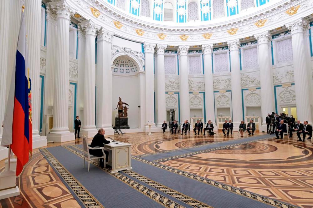 - AP
Russian President Vladimir Putin, left, chairs a Security Council meeting in the Kremlin in Moscow, Russia, Monday, Feb. 21, 2022.