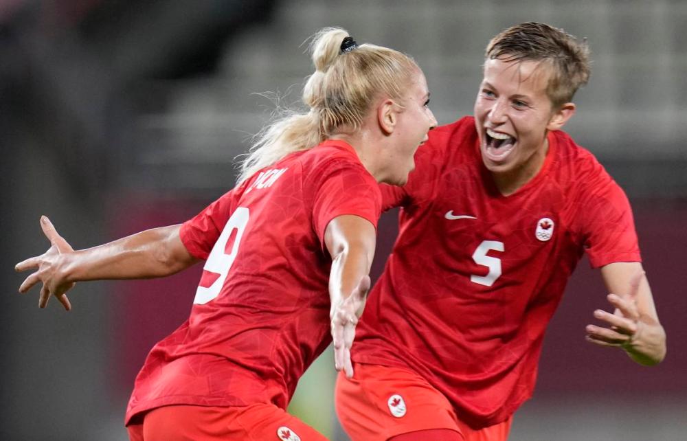 Fernando Vergara - The Associated Press file photo
Diligent defensive play by Quinn, right, helped teammate Adriana Leon and the Canadians advance to the Olympic gold-medal game.