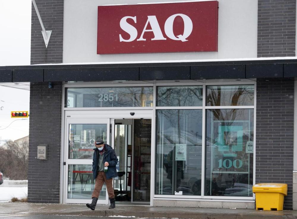 Ryan Remiorz - THE CANADIAN PRESS
A customer leaves an SAQ outlet on Jan. 6, 2022 in Deux-Montagnes, Que. The Quebec government announced that vaccine passports will be required to enter all government liquor stores and cannabis outlets. It’s a gamble that vaccine reluctance in Canada can be tackled with some of the same tools that governments have used to levy unpopular taxes, Susan Delacourt writes.
