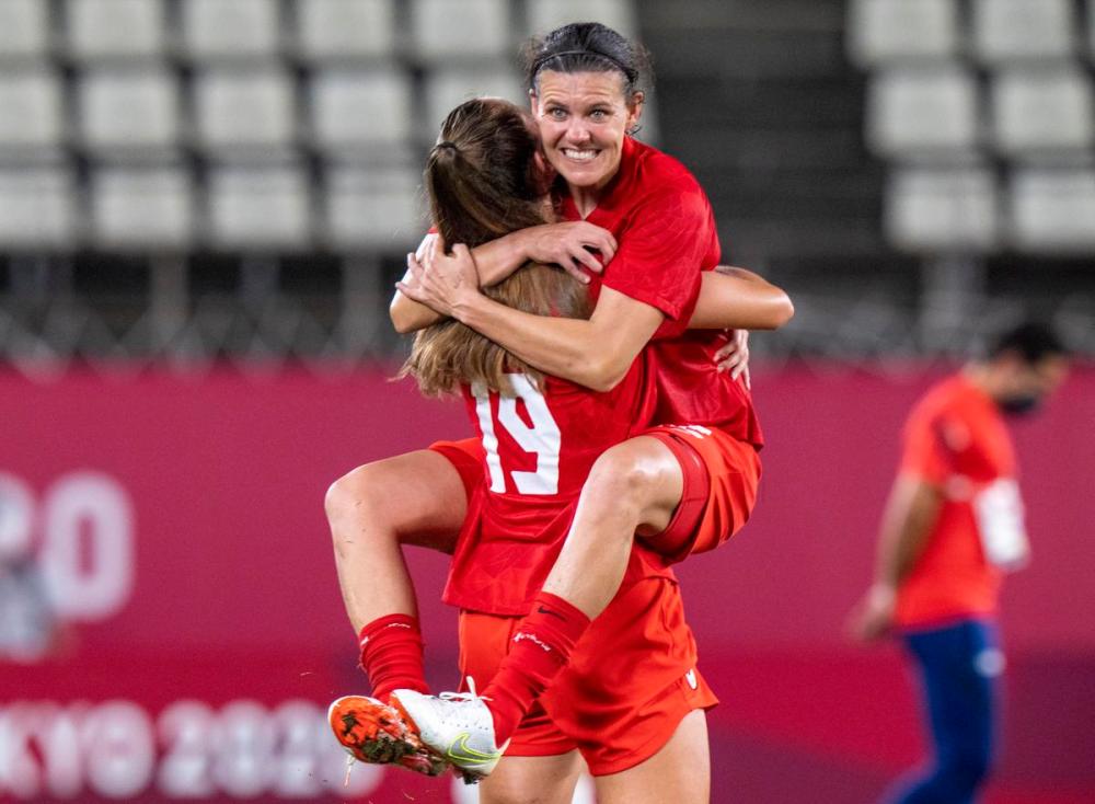 Frank Gunn - THE CANADIAN PRESS
Longtime Canadian women’s soccer star Christine Sinclair leaps into the arms of teammate Jordyn Huitema after Canada booked its spot in the gold-medal game in Tokyo.