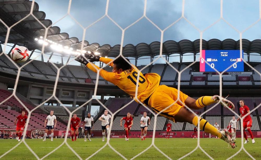 Naomi Baker - Getty Images
Jesse Fleming beats American keeper Adrianna Franch from the penalty spot, the only goal in Canada’s 1-0 semifinal upset of the United States.