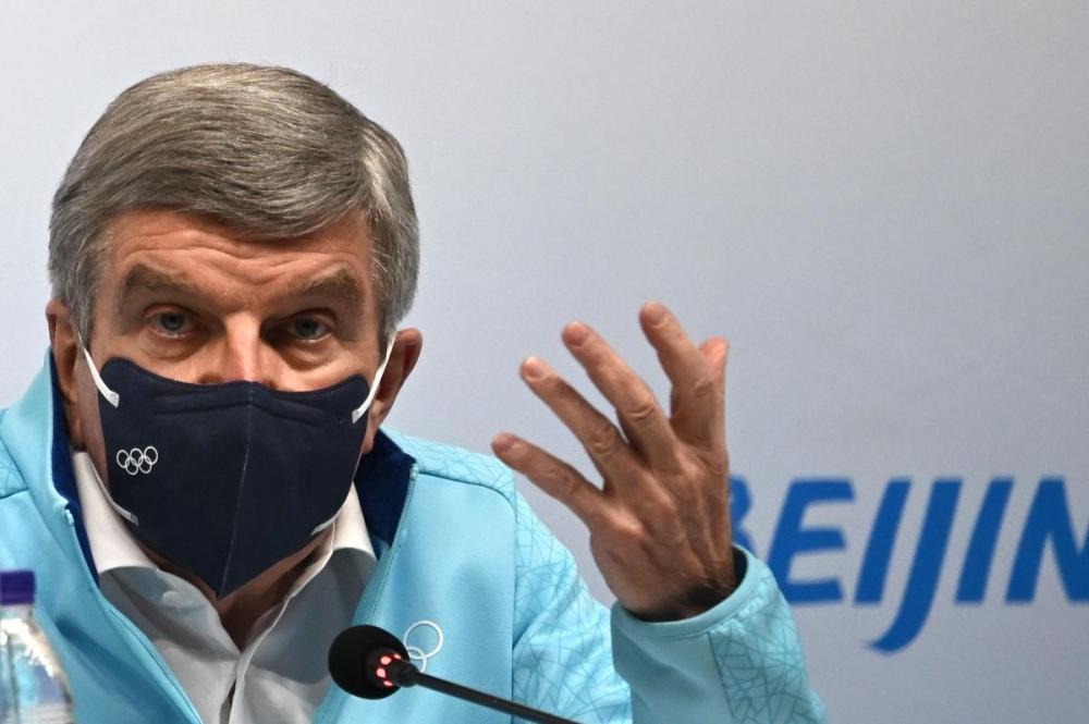 ANNE-CHRISTINE POUJOULAT - AFP via GETTY IMAGES
IOC president Thomas Bach addresses journalists during a news conference at the Main Media Center on Thursday ahead of the Beijing Olympics.