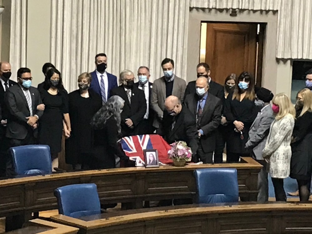 A Manitoba flag was draped the back of her MLA Danielle Adams' chair. The NDP member for Thompson was killed in a car accident on Thursday. (Carol Sanders / Winnipeg Free Press)