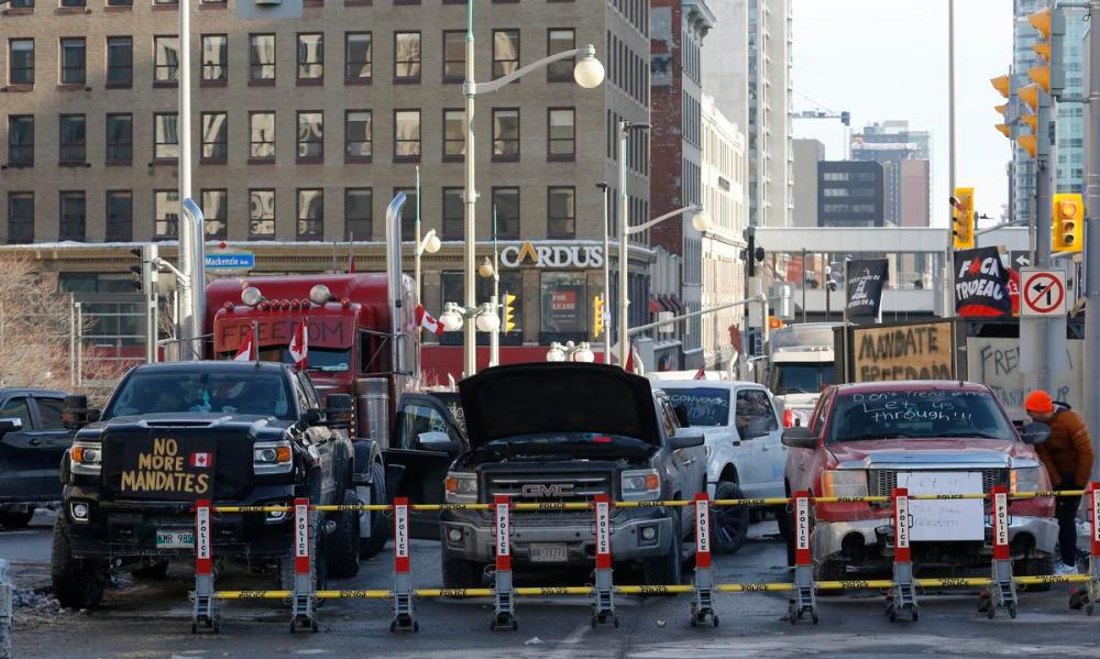 PATRICK DOYLE - THE CANADIAN PRESS
Trucks are blocked by police barricades as the rally against COVID-19 restrictions continued in Ottawa this week.