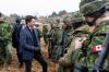TOMS NORDE - AFP via GETTY IMAGES
Prime Minister Justin Trudeau talks with soldiers during a visit at the Adazi military base, north east of Riga, Latvia, on March 8, 2022.