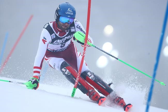 Austria's Marco Schwarz speeds down the course during an alpine ski, men's World Cup slalom in Zagreb, Croatia, Wednesday, Jan. 6, 2021. (AP Photo/Marco Trovati)