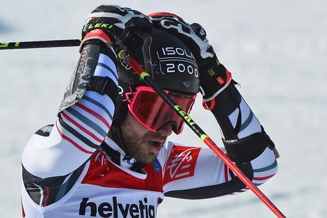 France's Mathieu Faivre reacts after winning the gold medal in a men's giant slalom, at the alpine ski World Championships, in Cortina d'Ampezzo, Italy, Friday, Feb. 19, 2021. (AP Photo/Marco Tacca)