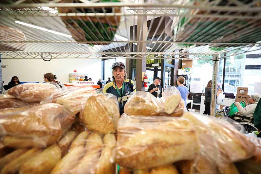 William Van Derbos looks over all the varieties of breads he can choose from.