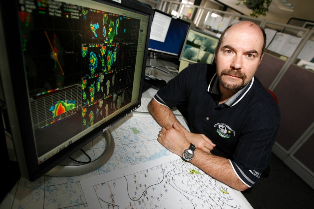 MIKE APORIUS / WINNIPEG FREE PRESS FILES
Paola with a radar cross-section of a storm in June 2008 while working at Environment Canada.