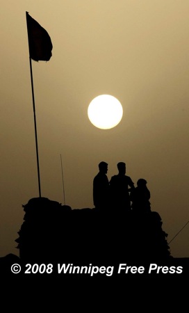 JOE BRYKSA/WINNIPEG FREE PRESS
WINNIPEG OUT-Panjwayi District, Afghanistan- Afghanistan National Army members watch the sunset at a forward operating camp in the Panjwayi District of Afghanistan Wednesday night- Aug 06, 2008