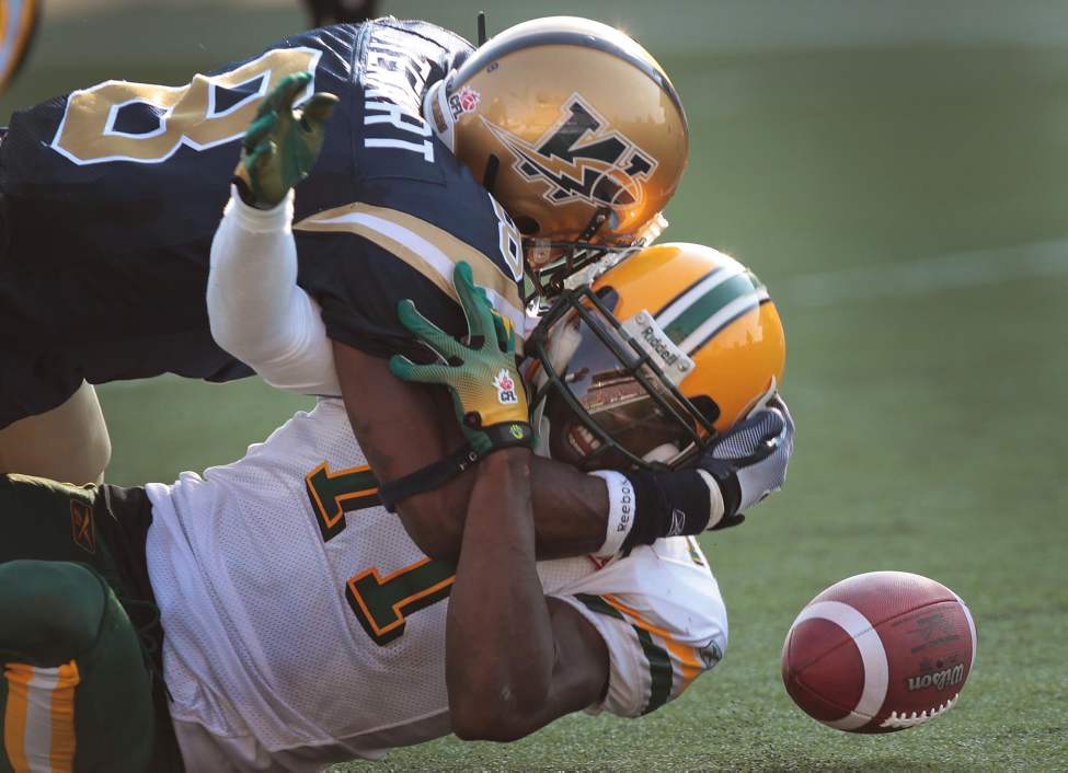 JOE BRYKSA/WINNIPEG FREE PRESS
Winnipeg Blue Bomber Bradon Stewart, top, strips the ball from Edmonton Eskimos' Kelly Campbell during second-quarter CFL action at Canad Inns Stadium. July 24, 2010