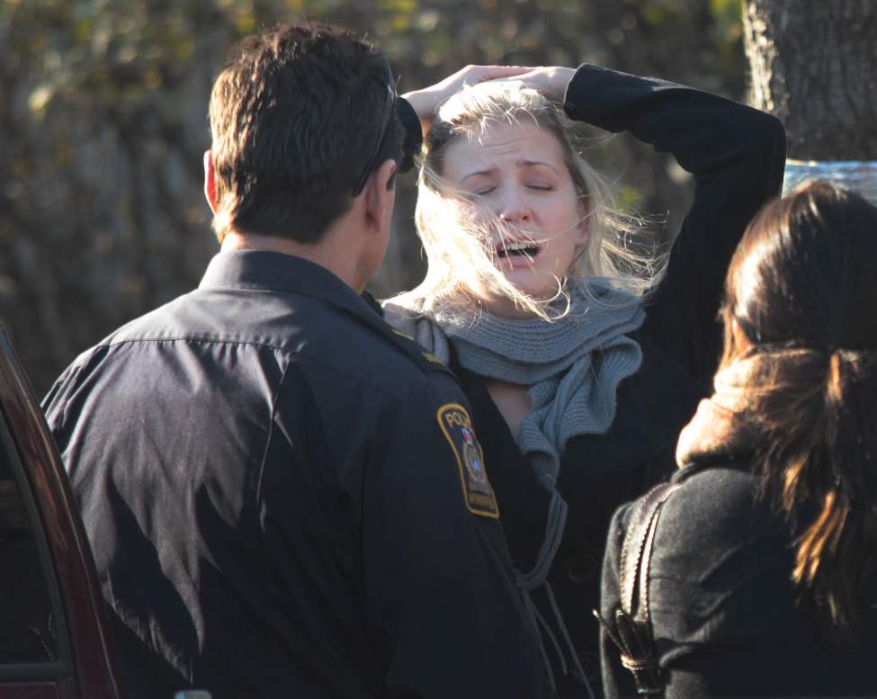 JOE BRYKSA/WINNIPEG FREE PRESS
Winnipeg Police console Paddy Kachkan, ex-wife of shooting victim Daniel Kachkan , who is overcome with emotion in front of 99 Barber St Monday afternoon near 3:30 pm. Police were called to the address after family members reported a serious situation. November 01, 2010.