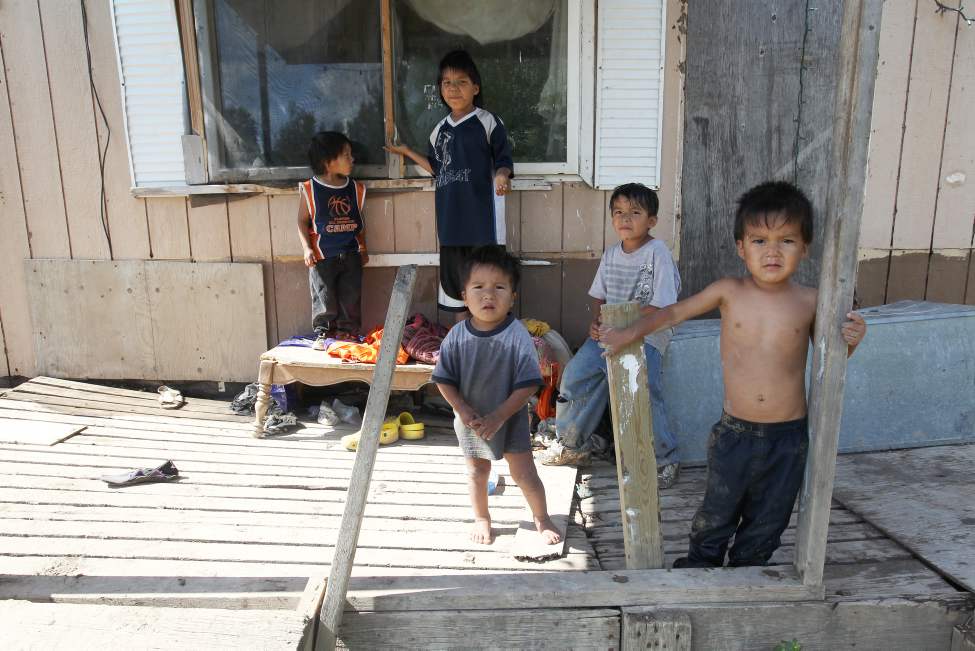Wasagamack First Nation- Richard Andrews' grandchildren run in and outside their rundown trailer. Up to 13 people are crammed into the home without running water.    
(JOE BRYKSA / WINNIPEG FREE PRESS)