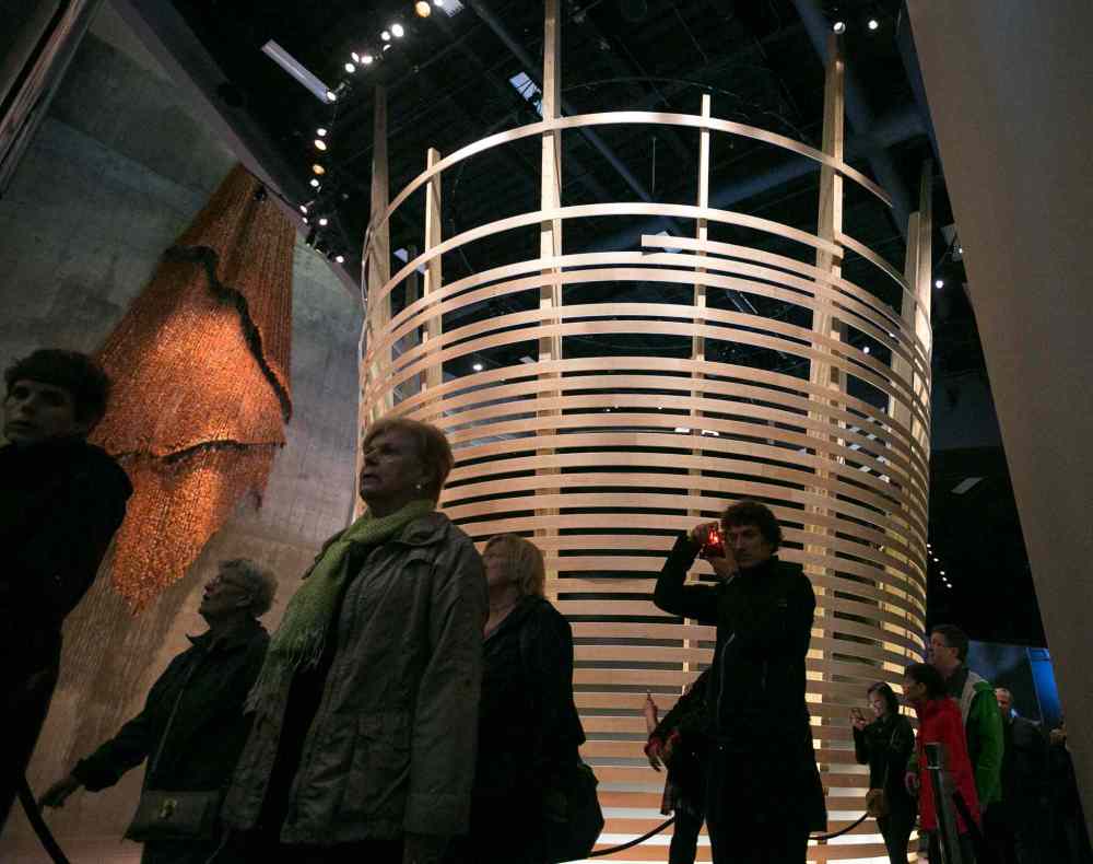 Melissa Tait / Winnipeg Free Press
Visitors walk past the inverted woven basket in the Indigenous Perspectives gallery at the Canadian Museum for Human Rights on Saturday. Thousands had reserved tickets for the four gallery preview tour on Saturday and Sunday. That is only four of 11 galleries, the rest of which open Sept. 27.