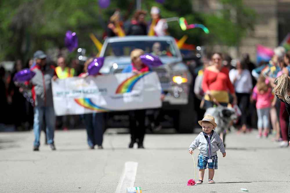 Eric Broadfoot, 16 months, in front of a float during the Pride Parade, Sunday, June 3, 2018.