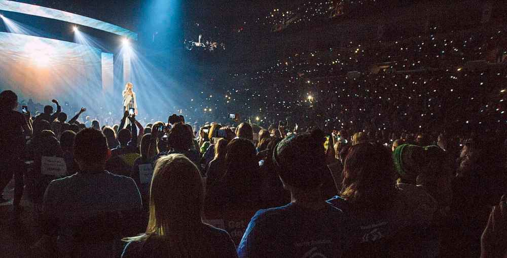 singer and actress Auli'i Carvalho performs in front of thousands of We Day participants.