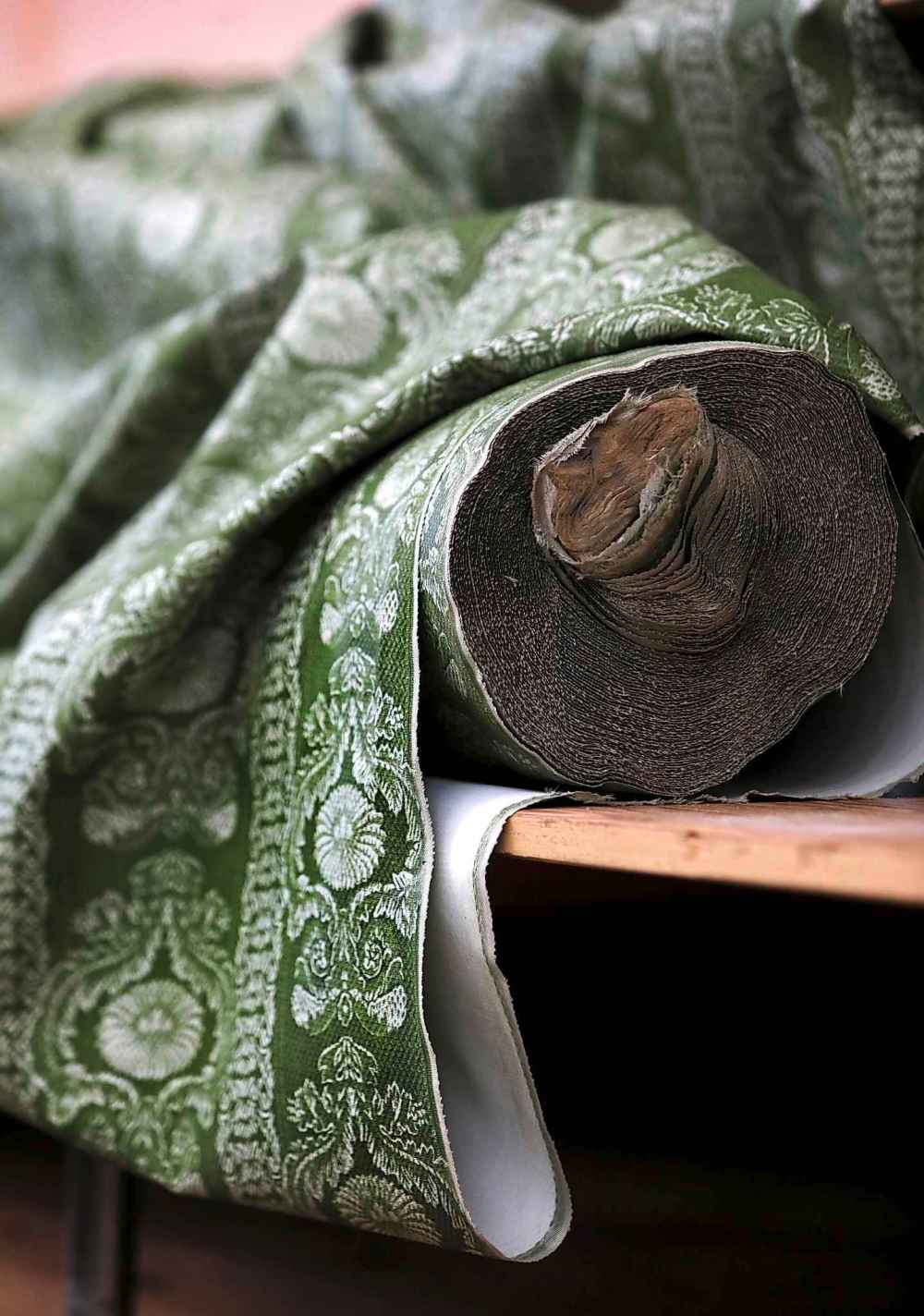 Ruth Bonneville
A bolt of olive green brocade fabric left behind on a shelf.