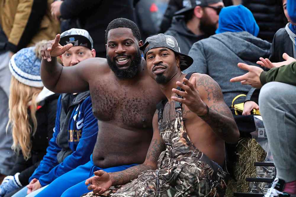 Blue Bombers (from left) Chad Rempel, Stanley Bryant and Darvin Adams,celebrate along with their teammates on a float. (Ruth Bonneville / Winnipeg Free Press)