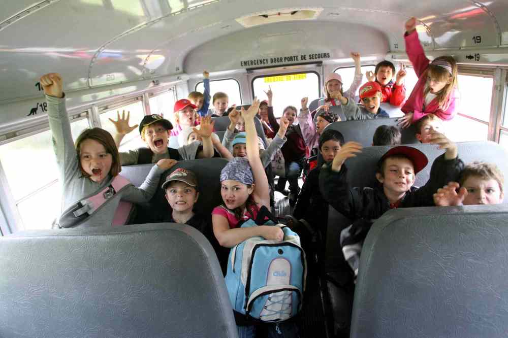 Grade 2: Students are excited about being on a school bus together for school outing to St. Vital Park. (Ruth Bonneville / Winnipeg Free Press)
