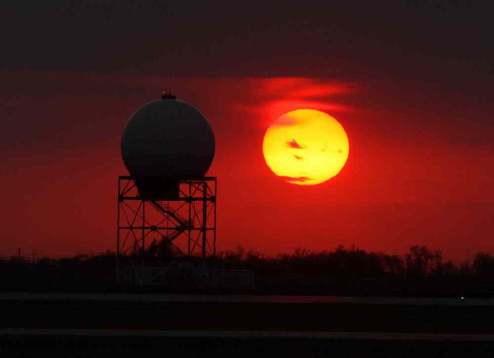 The sun sets with spectacular colour at James A Richardson International Airport. May 01, 2015 (JOE BRYKSA / WINNIPEG FREE PRESS)