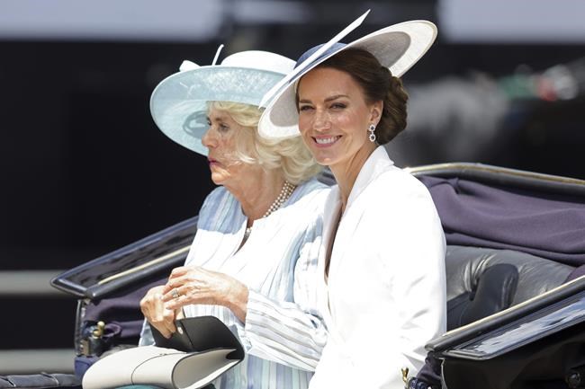 Camilla, Duchess of Cornwall, left, and Kate, Duchess of Cambridge ride in a carriage during the Trooping the Color, in London, Thursday June 2, 2022, on the first of four days of celebrations to mark the Platinum Jubilee. The events over a long holiday weekend in the U.K. are meant to celebrate the monarch’s 70 years of service. (Chris Jackson/Pool via AP)