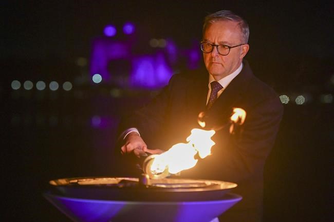 Australian Prime Minister Anthony Albanese lights the beacon for Queen Elizabeth II Platinum Jubilee celebrations in Canberra, Australia, Thursday, June 2, 2022. (Mick Tsikas/AAP Image via AP)