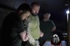 In this photo provided by the Ukrainian Presidential Press Office, Ukrainian President Volodymyr Zelenskyy, left, listens to a servicemen report close to front line in Donetsk region, Ukraine, Sunday, June 5, 2022. (Ukrainian Presidential Press Office via AP)