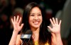 FILE - Former figure skater Michelle Kwan waves at an on-ice recognition for her World Figure Skating Hall of Fame induction at the U.S. Figure Skating Championships in San Jose, Calif., Saturday, Jan. 28, 2012. Michelle Kwan, Lindsey Vonn, Mia Hamm, Billie Jean King and the late Pat Summitt are among the nine individual women who will be inducted into the U.S. Olympic and Paralympic Hall of Fame this summer, along with Michael Phelps and hurdling legend Roger Kingdom. (AP Photo/Jeff Chiu, File)