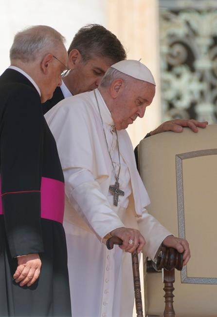FILE -- Pope Francis walks with a cane as he arrives for his weekly general audience in St. Peter's Square at The Vatican, Wednesday, June 1, 2022. Pope Francis canceled a planned July trip to Africa on doctors' orders because of ongoing knee problems, the Vatican said Friday, June 10, 2022, raising further questions about the health and mobility problems of the 85-year-old pontiff. (AP Photo/Gregorio Borgia)