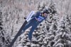 FILE - United States' Annika Malacinski competes during the Nordic combined World Cup mixed team normal hill HS 106, in Val di Fiemme, Italy, Jan. 7, 2022. Malacinski is one of dozens of women around the world who are in it for the glory, sacrificing a lot of time and money to go for Olympic gold. (AP Photo/Elvis Piazza, File)