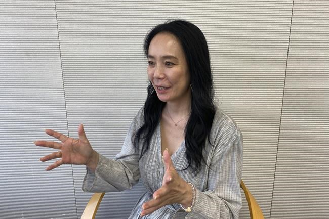 Naomi Kawase, who directed the official documentary of the Tokyo Olympics, speaks to The Associated Press in Tokyo Friday, June 17, 2022. Kawase said her work was a challenge because public opinion was painfully divided, costs kept mounting, a scandal emerged over the logo design, disgruntled opening ceremony artists resigned and the Games were postponed for a year because of the coronavirus pandemic. (AP Photo/Yuri Kageyama)