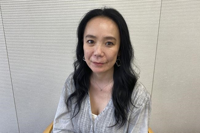 Naomi Kawase, who directed the official documentary of the Tokyo Olympics, speaks to The Associated Press in Tokyo Friday, June 17, 2022. Kawase said her work was a challenge because public opinion was painfully divided, costs kept mounting, a scandal emerged over the logo design, disgruntled opening ceremony artists resigned and the Games were postponed for a year because of the coronavirus pandemic. (AP Photo/Yuri Kageyama)