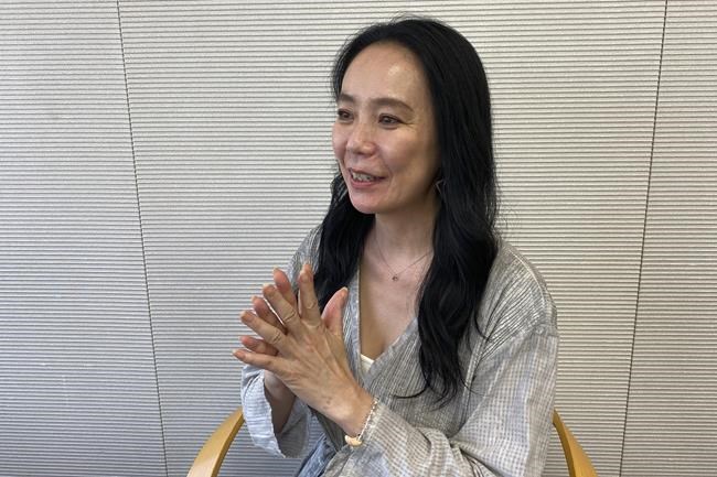 Naomi Kawase, who directed the official documentary of the Tokyo Olympics, speaks to The Associated Press in Tokyo Friday, June 17, 2022. Kawase said her work was a challenge because public opinion was painfully divided, costs kept mounting, a scandal emerged over the logo design, disgruntled opening ceremony artists resigned and the Games were postponed for a year because of the coronavirus pandemic. (AP Photo/Yuri Kageyama)