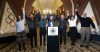 FILE - Salt Lake City Council Chairwoman Erin Mendenhall, from left, Fraser Bullock, chief operating officer of the 2002 Winter Games, Jeff Robbins, president and CEO of the Utah Sports Commission, Salt Lake City Mayor Jackie Biskupski, Gov. Gary Herbert, USA Olympic speed skater Catherine Rainey-Norman and Salt Lake County Councilman Jim Bradley raise their arms in celebration after the USOC choose Salt Lake over Denver to bid on behalf of the U.S. for future Winter Games, Friday, Dec. 14, 2018 in Salt Lake City. Recent meetings with the IOC have led U.S. officials to believe all signs point toward Salt Lake City bidding for the 2034 Winter Olympics, though they say Utah's capital will be ready if asked to host the 2030 Games, too. (Steve Griffin/The Deseret News via AP, File)
