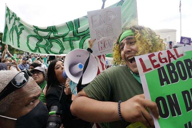 People protest about abortion, Friday, June 24, 2022, outside the Supreme Court in Washington. (AP Photo/Steve Helber)