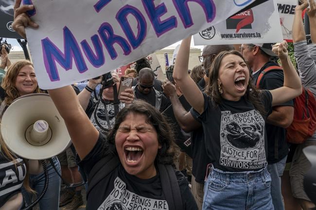 Anti-abortion protesters gather outside the Supreme Court in Washington, Friday, June 24, 2022. The Supreme Court has ended constitutional protections for abortion that had been in place nearly 50 years, a decision by its conservative majority to overturn the court's landmark abortion cases. (AP Photo/Gemunu Amarasinghe)