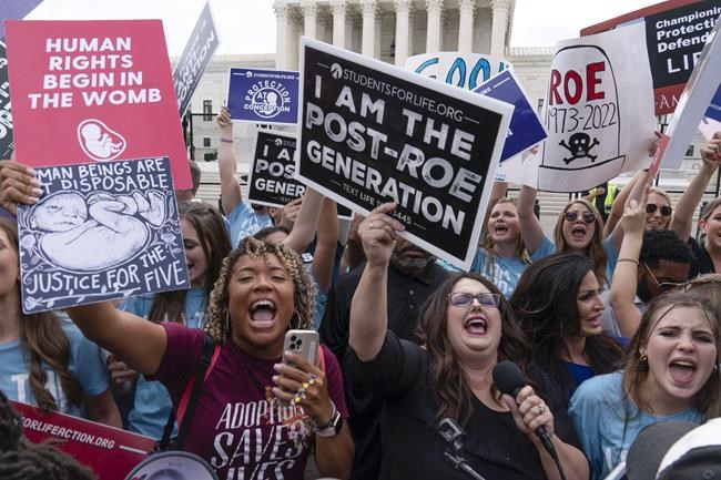 Demonstrators gather outside the Supreme Court in Washington, Friday, June 24, 2022. The Supreme Court has ended constitutional protections for abortion that had been in place nearly 50 years, a decision by its conservative majority to overturn the court's landmark abortion cases. (AP Photo/Jose Luis Magana)