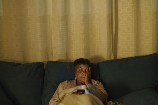 Tanya Britton prays on her living room couch at 5 a.m. after waking up early to pray, Wednesday, May 25, 2022, in Tupelo, Miss. On Friday, as she does every day, she rose early and prayed. When the news broke that the Supreme Court ruled to overturn Roe v. Wade, she immediately felt washed over with a paralyzing happiness. Her throat tightened. Tears welled. She felt numb all over. Abortions will continue, she knows, and so her work continues too. As it all sank in and the moment she spent years praying for arrived. (AP Photo/David Goldman)