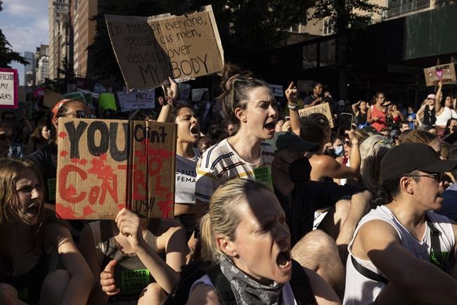 Abortion-rights activists sit on the street during a protest following Supreme Court's decision to overturn Roe v. Wade, Friday, June 24, 2022, in New York. (AP Photo/Yuki Iwamura)