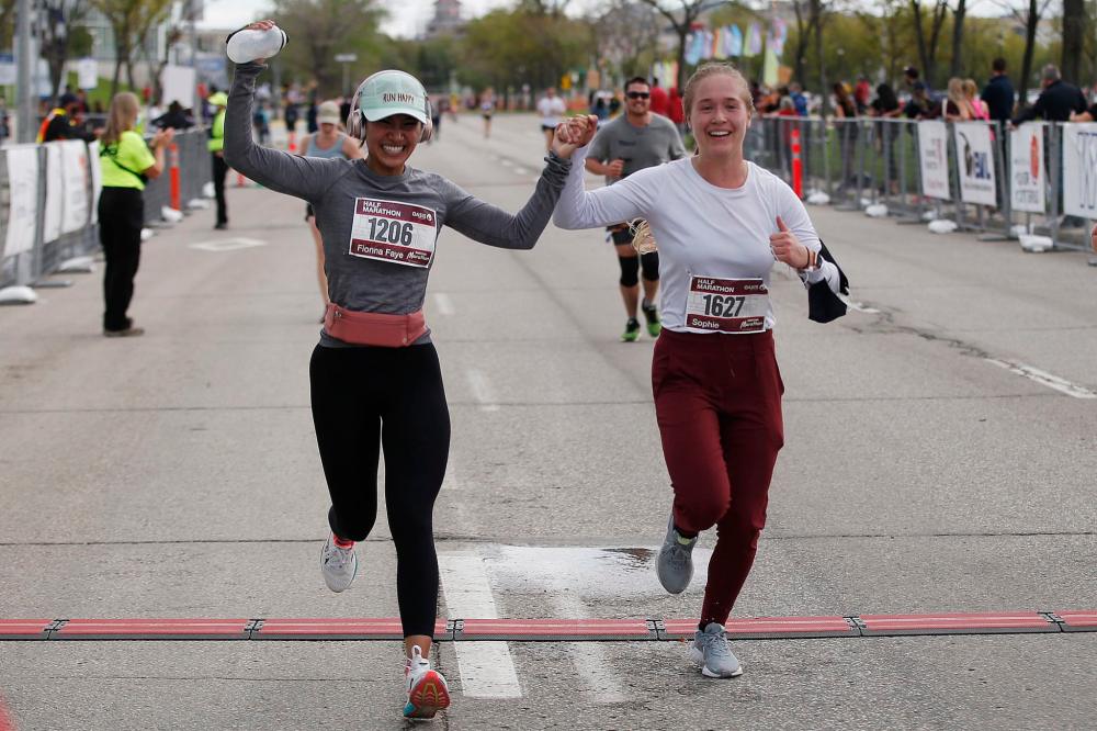 JOHN WOODS / WINNIPEG FREE PRESS
Runners cross the finish at the Manitoba Marathon at the University of Manitoba.