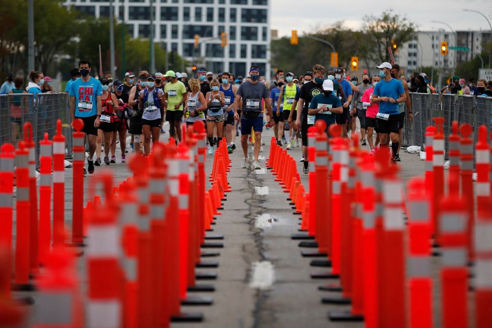 JOHN WOODS / WINNIPEG FREE PRESS
Runners wait to enter corrals at the start at the Manitoba Marathon at the University of Manitoba in Winnipeg Sunday.